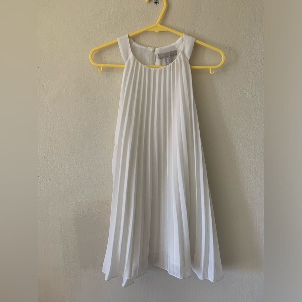 H&M’s Sun pleated sleeveless dress.